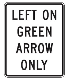 Image of a sign that reads 'Left on Green Arrow Only.'