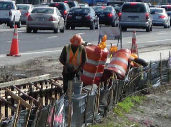 Construction workers installing sidewalks along Dale Mabry Highway (SR580) in Tampa, Florida