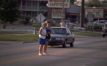 Photo of pedestrians crossing a street
