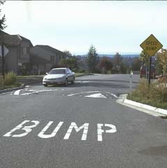 Speed bumps can be combined with curb extensions and a winding street alignment. Signing and pavement markings should clearly identify the bump.