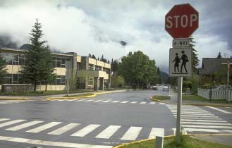 Photo of an intersection: Stop for me it's the law
