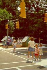 A mock-up of a miniature downtown area enables these children in Greensboro, NC, to learn pedestrian safety. 