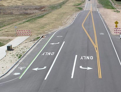 Photo: Left- and right-turn lanes on a two-lane road.