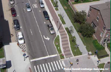 Aerial photo of parallel bike and pedestrian paths in advance of a bulbout protecting a crosswalk. Photo: Rundell Ernstberger Associates, LLC