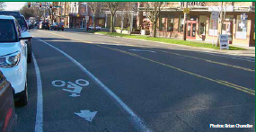 Dedicated bike lanes separates the through lanes from on-street parking.