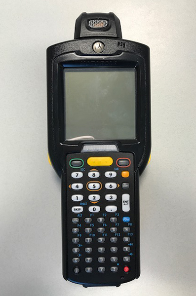 Figure 7.  Photo.  Barcode scanner.  This photo shows a handheld barcode scanner. The scanner has a screen and extensive keypad.