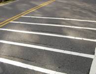 Photo. Lines with rumble strips applied across the entire width of a lane