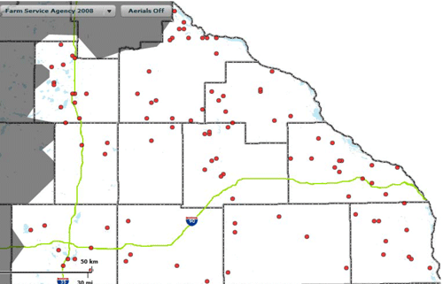 Screenshot of the Minnesota Crash Mapping Analysis Tool. The screenshot shows a GIS map of Minnesota's southeastern District with I-35 and I-90 present on the map. Red dots on the map represent severe (K and A) roadway departure crashes at curves over a five year period.