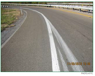 A ramp with darker pavement indicating that the road has been treated with HFST. Photo: KYTC