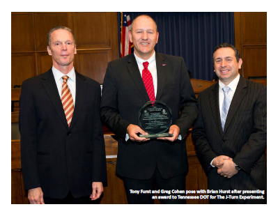 Tony Furst and Greg Cohen pose with Brian Hurst after presenting an award to Tennessee DOT for The J‐Turn Experiment.