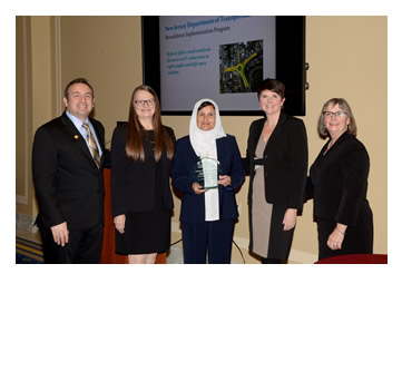 Photo: Greg Cohen, Brandye L. Hendrickson and Beth Alicandri pose with Caroline Trueman and Sophia Azam after presenting an award to New Jersey's Department of Transportation for its Roundabout Implementation Program.