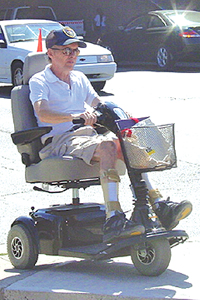 Photo showing a person on a motorized mobility device.