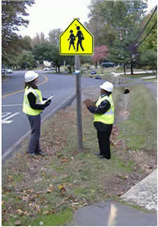 RSA Team examining pedestrian sign