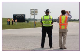 Photo of an RSA team examining different safety aspects of a rural intersection.