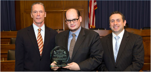 Andy Kaplan (center) accepting award for Rutgers' CAIT. Source: FHWA