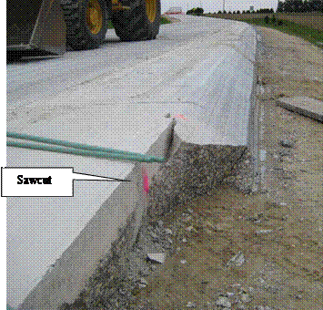 Photo of cured PCC pavement where SafetyEdge has been cut out to abut fresh pavement for an intersecting road.