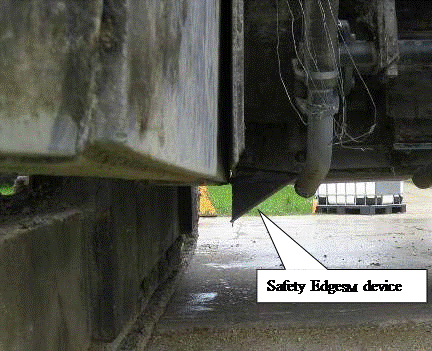 close-up photo of safety edge device attached to the paver shown from underneath.