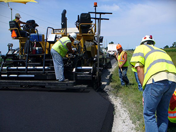 Photo: Workers using Roadway equipment