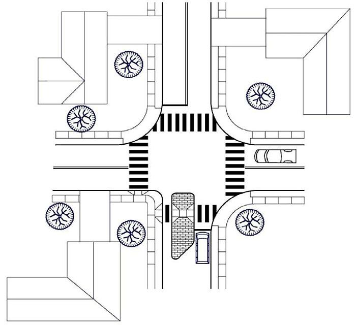 Figure 3.23.1. Half Closure Schematic â€“ Blocking Entry to Side Street. This figure contains a schematic of a four leg intersection drawn from an overhead view. Only the bottom right quadrant of the intersection doesn't have a house. The bottom leg of the intersection has an island blocking most of the left lane, allowing a path for drainage and a bicycle between the left curb and the island. To the right of the island there is enough room for a car to pass, indicated by a vehicle occupying that lane. A vehicle is also drawn in on the right leg in the top lane.