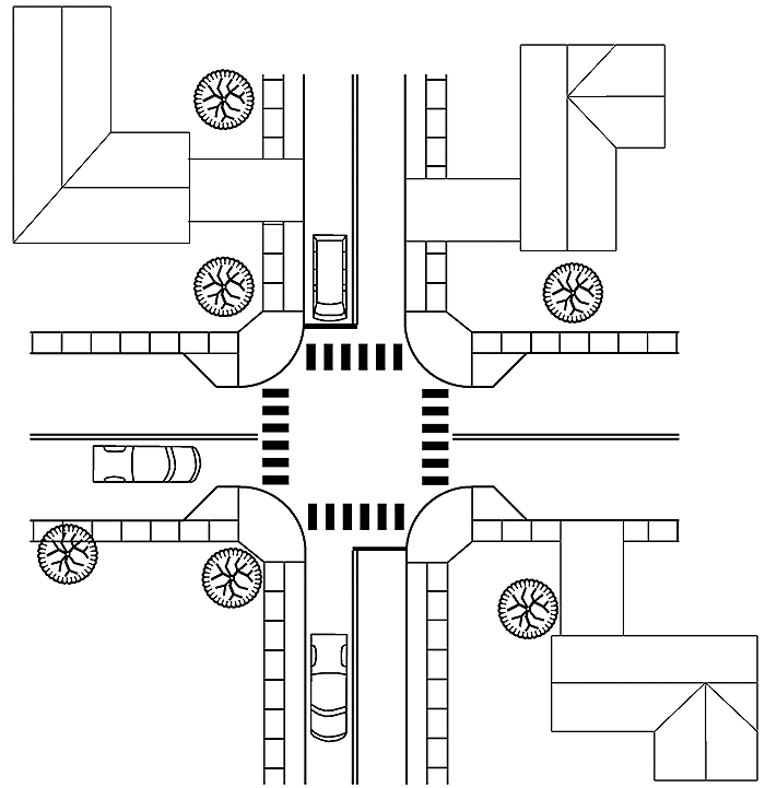 Figure 3.16.1. Corner Extension Schematic. This figure contains a line drawing of the use of corner extensions in an intersection. The top left and right and bottom right corners contain houses. The street running left to right is narrowed at the intersection by rounded corner extensions jutting out into the street. There is a truck in the bottom lane of the left hand street. A van waits in the left hand lane of the top section of street. A car has passed through the intersection and is in the left hand lane in the bottom section of street.