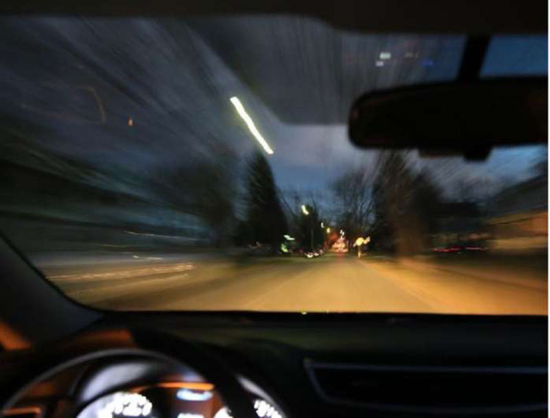 Stylized stock art photo of the interior of a speeding vehicle.
