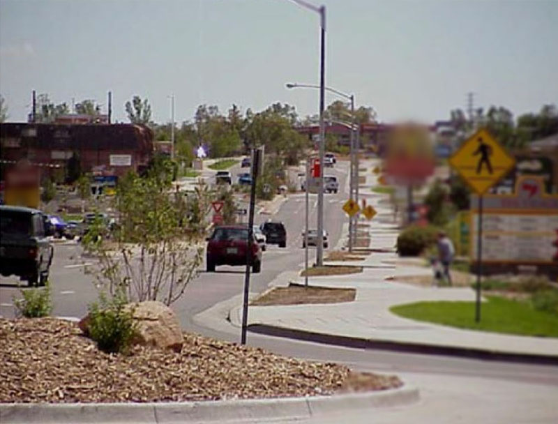 Photo of South Golden Road after numerous improvements featuring roundabouts and other safety measures where the design supports speed compliance even with a 25 mph speed limit in addition to enhancing access, operations, and safety for all users.