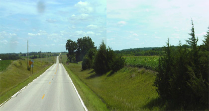 Photograph - Photograph displaying a rural two-lane highway with no shoulder but a large, usable clear zone.